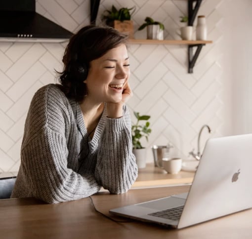 Woman videocalling using a laptop